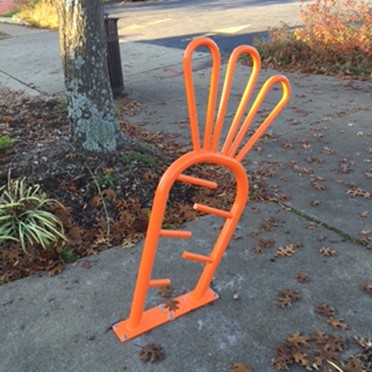 Orange carrot-shaped bike rack by The Root in Little Rock