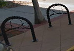 Bike rack with circles by Stockman Bank