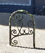 Bike rack with curly patterns in front of Mexicantown Bakery