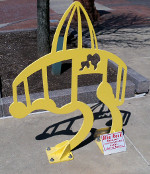 Yellow Football Hall of Fame-shaped bike rack