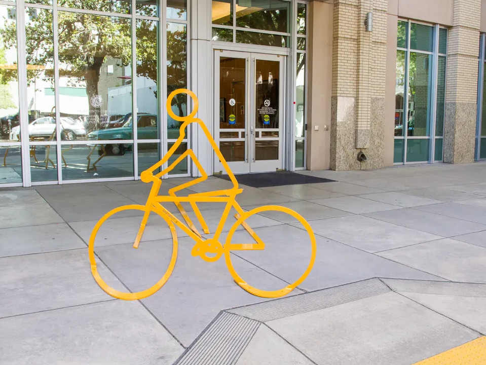 Bike racks that line up to form a person on a bike - Sacramento, CA