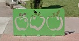 Green apple-shaped bike rack by Farmers Market