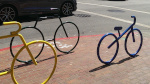 Colorful bicycle-shaped bike racks by Walgreens San Mateo