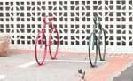 Two colorful bike racks by San Bruno Library entrance