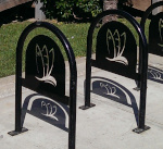 Three artistic bike racks with surfboards by Taco Bell Pacifica entrance